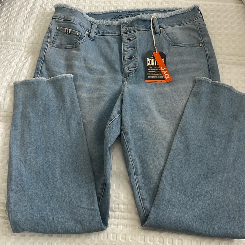 Jag faded jeans with frayed edges.